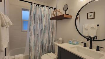 Combined shower/tub, hair dryer, towels, soap