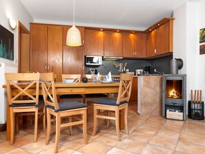 Enjoy cooking in this well-equipped kitchen with a microwave, stove, and dining area.