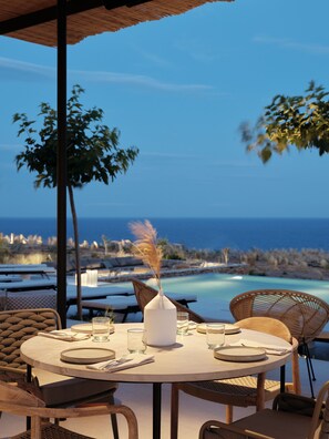 Breakfast, lunch, dinner served; Mediterranean cuisine, pool views  - NOS Hotel & Villas (Sifnos)
