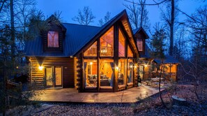 A log cabin with a large deck, multiple windows, and a balcony. - Kozy Bear 3 King BRs | Hot Tub | Pool Table (Sevierville)