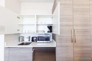 Microwave, coffee/tea maker, toaster, cookware/dishes/utensils