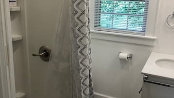 Shower, towels, soap, toilet paper