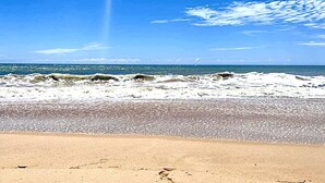 A beach with waves, clear sky, and a sandy shore. - Charming Villa With Pool, Near Beach, Sri Lanka (Kahandamodara)