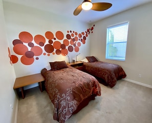 A bedroom with two beds, a wall mural, a ceiling fan, and a window with blinds. - TOP FLORIDA'S Villa Lazy River (North Fort Myers)
