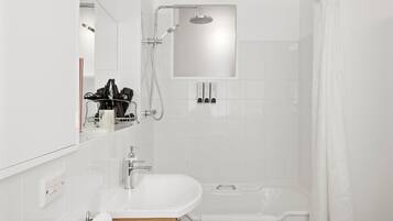 Combined shower/bathtub, hair dryer, towels, soap