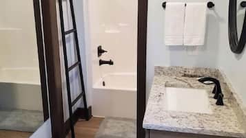 Combined shower/tub, hair dryer, towels, toilet paper