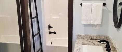 Combined shower/tub, hair dryer, towels, toilet paper