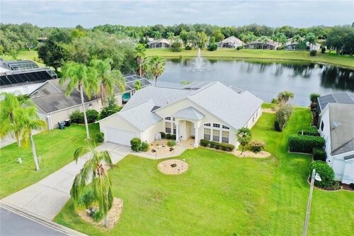 Beautiful waterfront home with heated pool and game room.