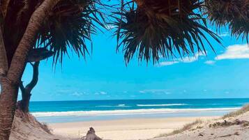 On the beach, sun-loungers