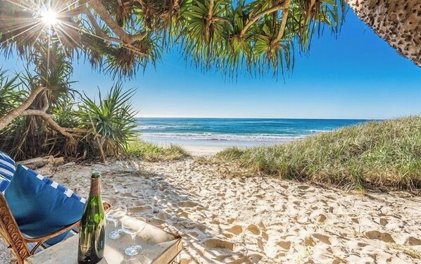 On the beach, sun-loungers