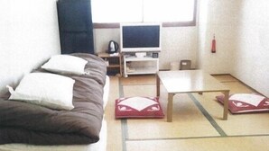 A room with a bed, a desk, a chair, and a television. - Free Days Inn Yokogawara (Toon)