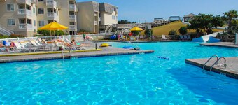 Second-Floor Condo with Side Ocean View & Shared Pools/Hot Tub/Putt-Putt