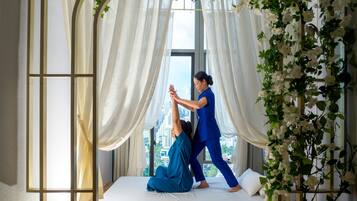A room with a bed, a window, and a curtain.