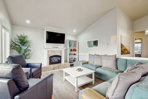 TV, fireplace, books - Serene, Dog-Friendly Beach House with Free WiFi & a Gas Fireplace (Westport)