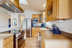 Fridge, microwave, oven, stovetop - Serene, Dog-Friendly Beach House with Free WiFi & a Gas Fireplace (Westport)