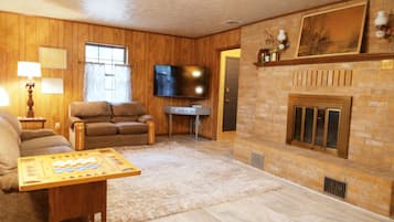 Smart TV, fireplace, foosball, books
