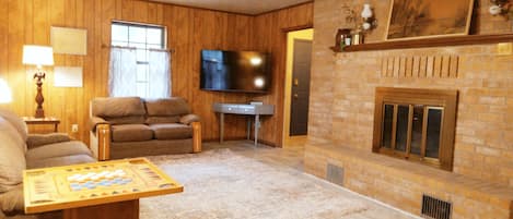 Smart TV, fireplace, foosball, books
