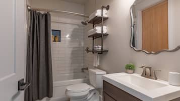 Combined shower/tub, towels, soap, shampoo