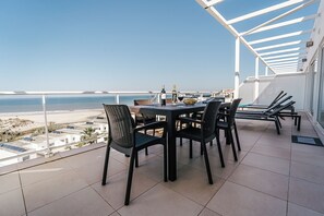 Outdoor dining - 'Beachfront Atlantic Sunset A07' with Shared Pool, Sea View & Wi-Fi (Obidos)
