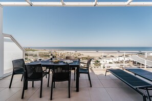 Outdoor dining - 'Beachfront Atlantic Sunset A07' with Shared Pool, Sea View & Wi-Fi (Obidos)
