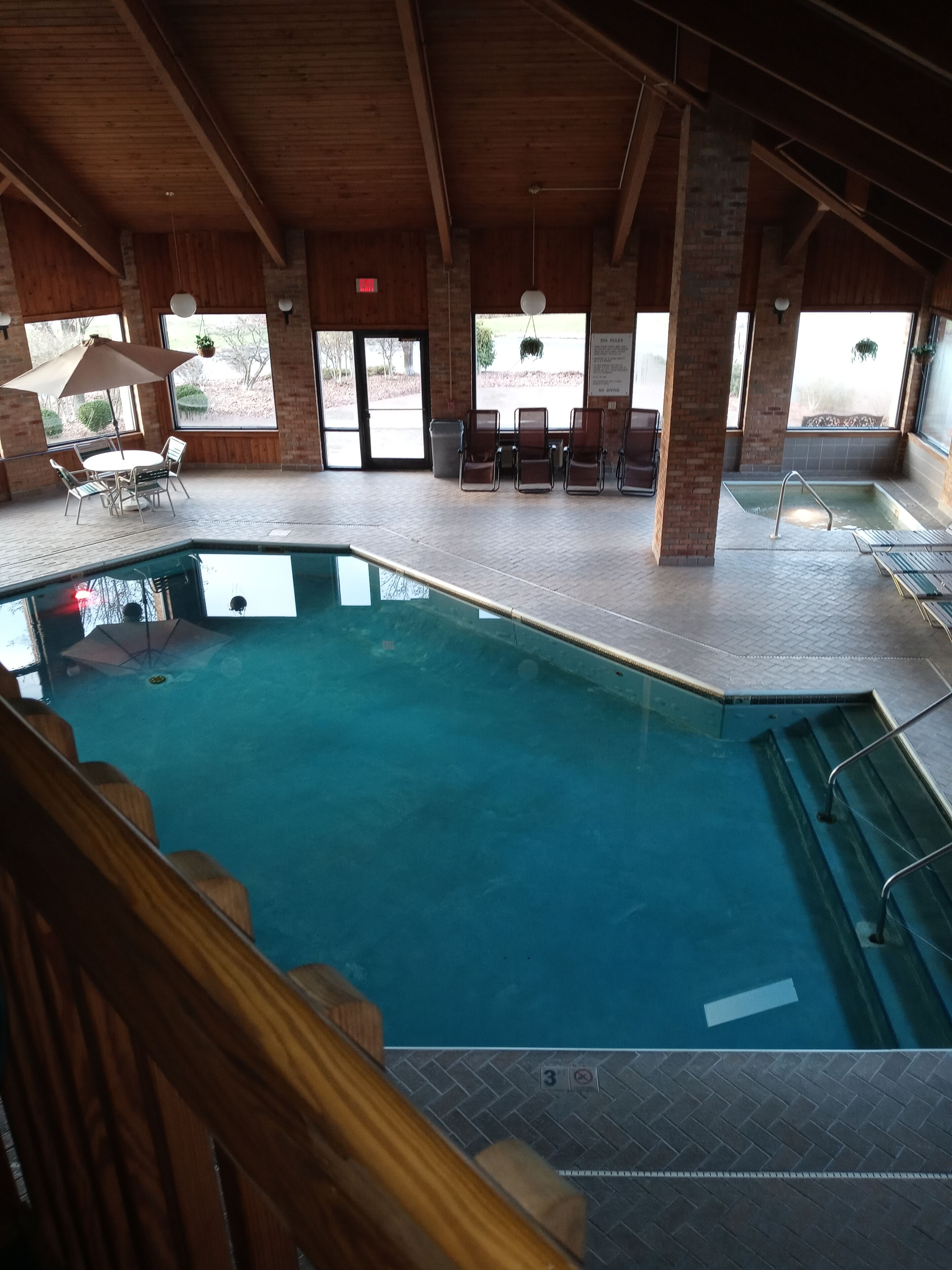 Indoor pool, open 8:00 AM to 10:00 PM, pool loungers