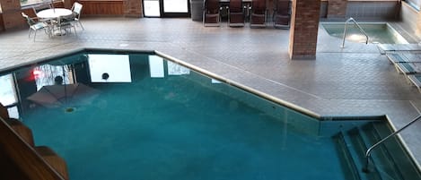 Indoor pool, open 8:00 AM to 10:00 PM, pool loungers