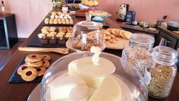 A buffet table with various food items including pastries, cookies, and dairy products. - Gaia B&b (Castrovillari)