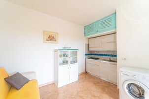 32-inch flat-screen TV with cable channels, TV