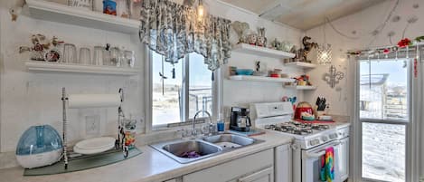 Fridge, microwave, stovetop, coffee/tea maker