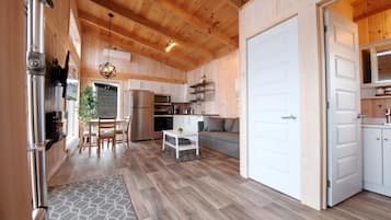 Waterfront chalets | Living area | 50-inch Smart TV with cable channels, TV