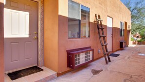 A building with a door, windows, a ladder, and a vent. - 'La Paloma' - Full Circle Ranch Studio w/ Views! (Cave Creek)