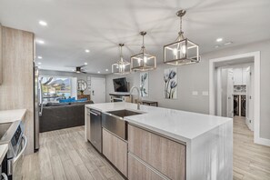 Enjoy meals in the kitchen with a sink and stainless steel appliances, including a dishwasher and oven.