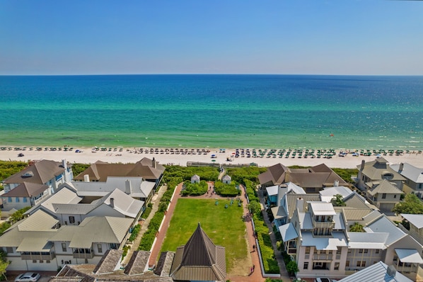 A coastal residential area with houses, a beach, and a clear view of the ocean. - The Savannah 2E | Rosemary Beach 30A | Luxurious Condo on Main | My Beach Getaways (Panama City Beach)