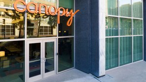 A building with a large glass facade and a sign that reads "canopy". - Canopy by Hilton New Orleans Downtown (New Orleans)