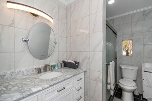 Bathtub, hair dryer, towels, soap