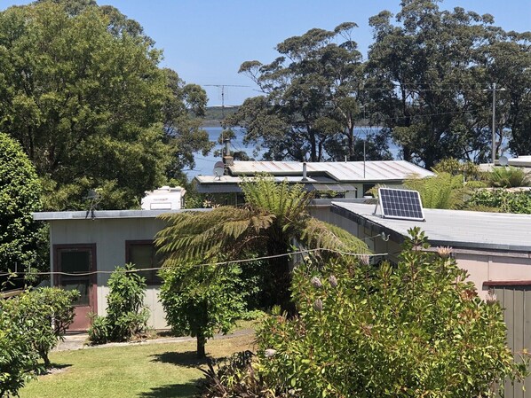 A residential area with houses, a satellite dish, and a solar panel.