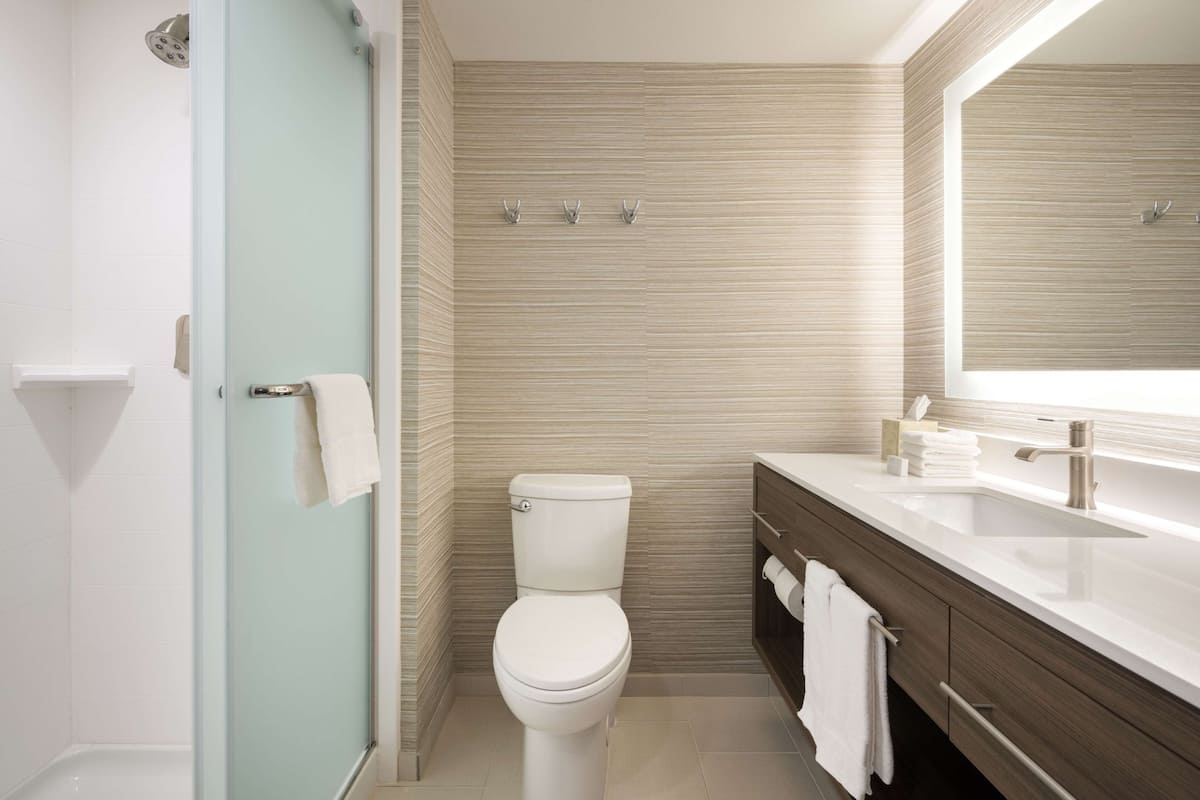 room, 2 queen beds, refrigerator & microwave | bathroom shower