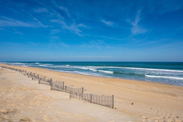 On the beach, sun-loungers, beach towels