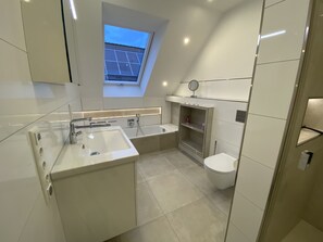 Bathtub, hair dryer, towels