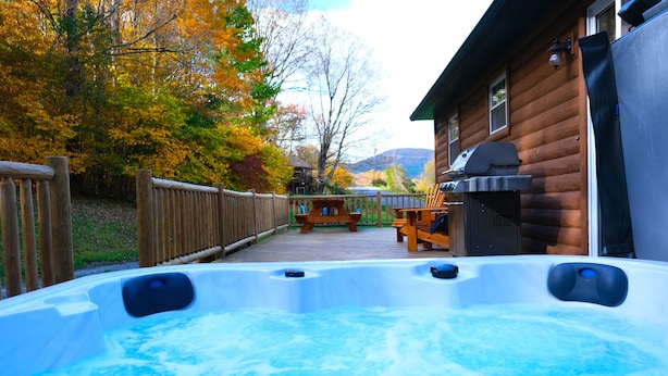 A hot tub in a backyard with a wooden deck, a barbecue grill, and a view of a mountain. - Mountain Getaway w/ Hottub, Views, Gamesroom, Fire Pit (Roxbury)