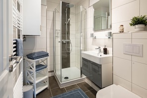 Shower, hair dryer, towels, soap