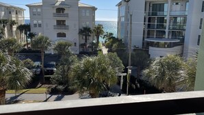 A view of a coastal building complex with multiple balconies and a clear view of the ocean. - Perfectly Curated 30A Escape - Steps to Beach & Gulf Place (Santa Rosa Beach)