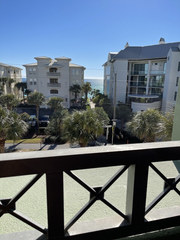 A view of a coastal building complex with multiple balconies and a clear view of the ocean. - You Want 30A, Stay on 30A! Salty Blonde @ Gulf Place steps from  deeded beach (Santa Rosa Beach)