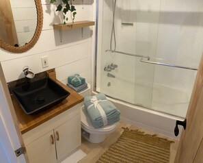 Combined shower/tub, hair dryer, towels, toilet paper