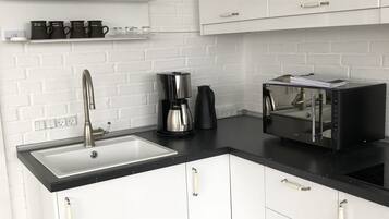 Fridge, microwave, stovetop, coffee/tea maker