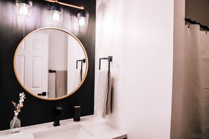 Combined shower/bathtub, hair dryer, towels, soap