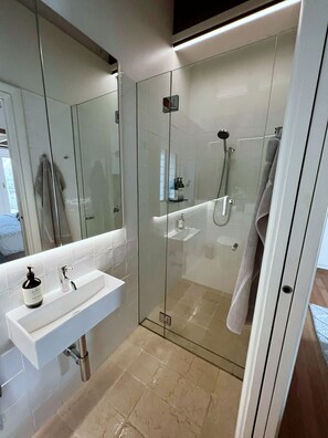 Bathtub, hair dryer, towels, soap