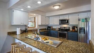 Coffee/tea maker, fridge, microwave, oven