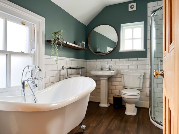 Bathtub, hair dryer, towels, soap