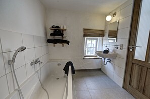 Bathtub, hair dryer, towels, soap